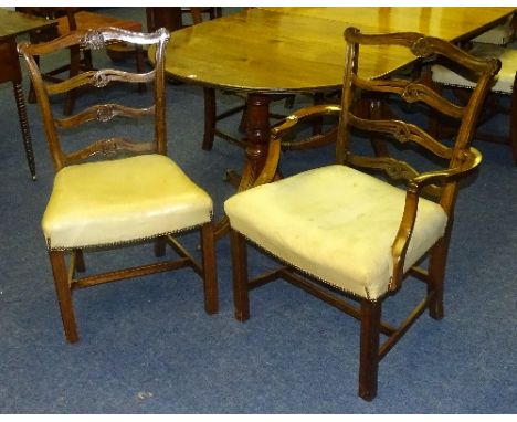 A set of six George III style mahogany dining chairs, including two carvers, with ladder backs above cream hide covered seats