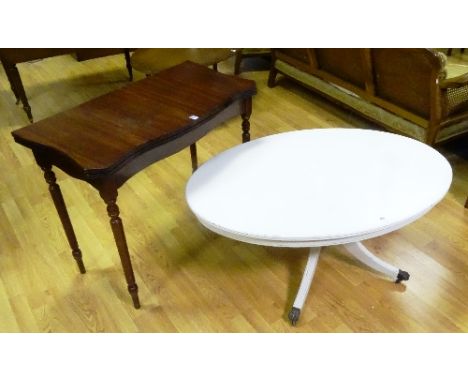 A reproduction mahogany fold over card table, the serpentine swivel top enclosing green and gilt leather interior, raised on 