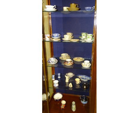 A collection of 19th century and later cabinet cups and saucers, to include various Victorian examples, Royal Crown Derby, Sp