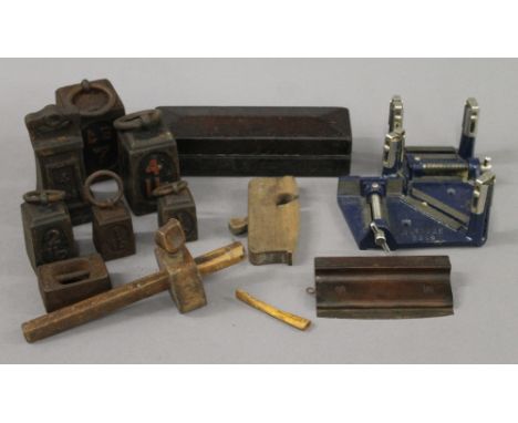 A box of vintage tools and shop weights