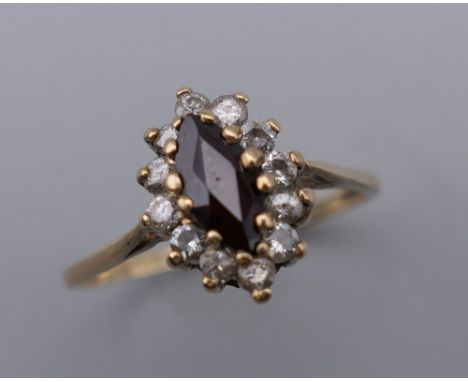 A 9 ct gold garnet set ring.