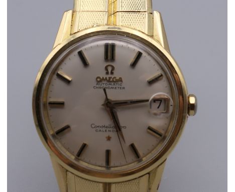 An 18 ct gold gentleman's Omega Constellation Automatic Chronometer wristwatch. 3.5 cm wide. 97.4 grammes total weight.