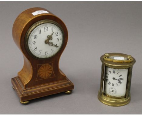 An Edwardian mahogany inlaid mantle clock and a carriage clock. The former 22 cm high.