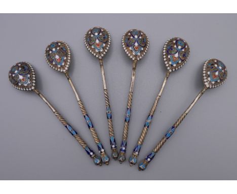 Six enamel decorated silver Russian teaspoons. Each 10.5 cm long. 79.4 grammes total weight. 