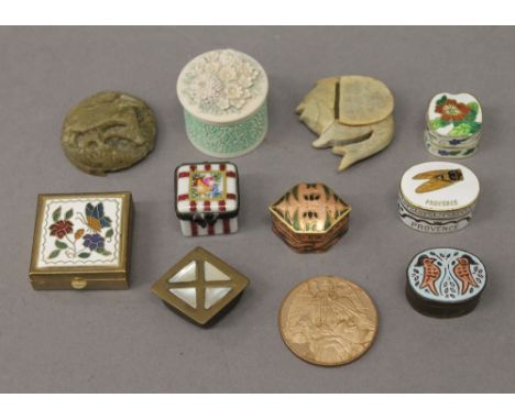A collection of small enamel and other boxes.