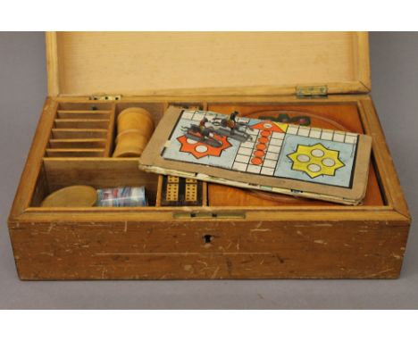 A vintage boxed games compendium. 34 cm wide.