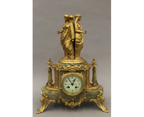 A Victorian gilt metal mounted onyx mantle clock. 50 cm high.