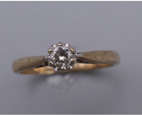 A 9 ct gold diamond solitaire ring. Ring Size N/O. 2.1 grammes total weight.