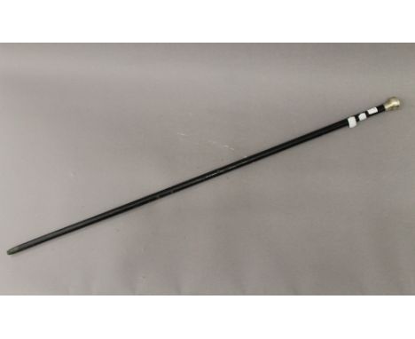 A silver topped walking stick. 91.5 cm long.