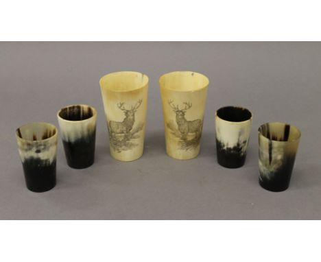Six vintage horn beakers, two carved with a stag. The largest 11.5 cm high.