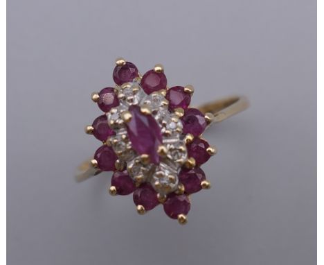 A 9 ct gold multi-stone ruby and diamond ring. Ring Size L. 1.9 grammes total weight.