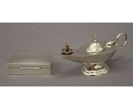 A 925 silver table lighter formed as an oil lamp and a miniature silver snuff box in the form of a cigarette box, hallmarked 