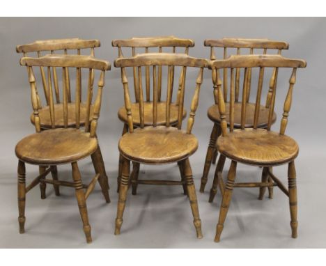 A set of six elm seated stick back kitchen chairs