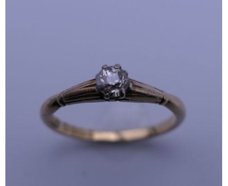 An 18 ct gold diamond solitaire ring. Ring size O. 2.4 grammes total weight.