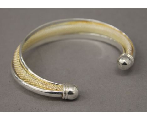 A silver torque bangle. 7.5 cm wide. 29.6 grammes