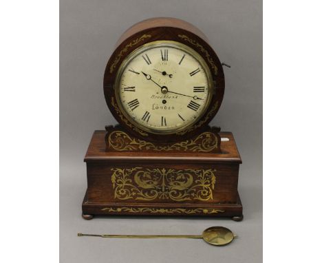 A 19th century brass inlaid rosewood fusee mantle clock, the dial inscribed 'Brockbank London'. 46 cm high.