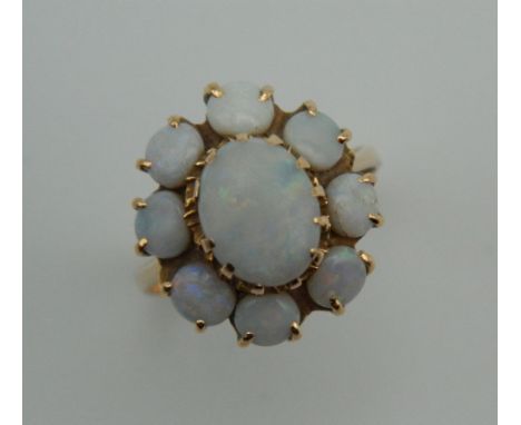 A 14 K gold and opal ring. Ring size N. 4.2 grammes total weight.