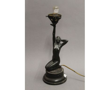 An Art Deco lamp formed as a nude lady. 32 cm high.