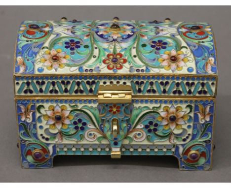 An enamel and cabochon decorated silver gilt casket, bearing Russian marks. 12 cm wide. 16.8 troy ounces total weight.