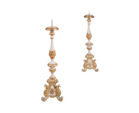 A PAIR OF GREY PAINTED AND PARCEL GILT PRICKET CANDLESTICKS ITALIAN, 19TH/20TH CENTURY The carved wood candlestick 81cm high,