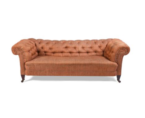 A LATE VICTORIAN MAHOGANY AND BUTTON UPHOLSTERED SOFA OF CHESTERFIELD TYPE, LATE 19TH CENTURY  Upholstered in terracotta abra