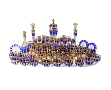 A VENETIAN CLEAR GLASS WITH BLUE FLASHED CABOUCHONS, RESERVED ON A GILT VERMICULAR GROUND PART TABLE SERVICE  MID 20TH CENTUR