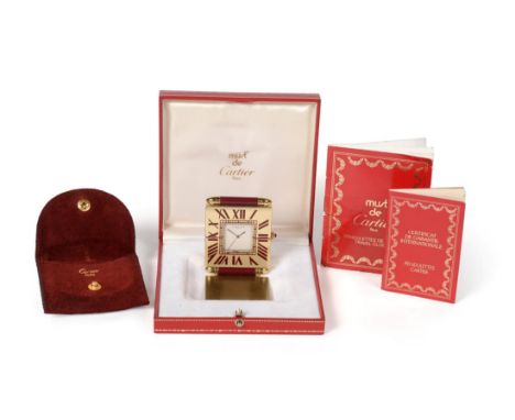 A Gilt Metal Travelling Alarm Timepiece, signed Must de Cartier, Paris, circa 2000, quartz movement, silvered dial signed, sq