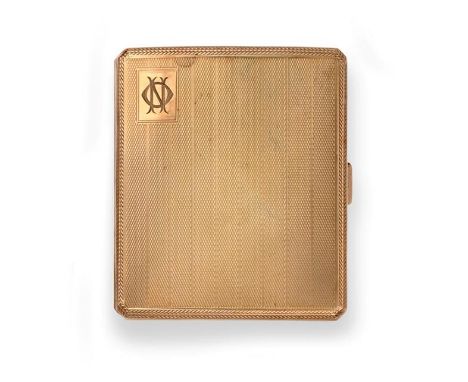 A George V Gold Cigarette-Case, by Cohen and Charles, London, 1929, 9ct, slightly curved oblong and with engine-turned decora