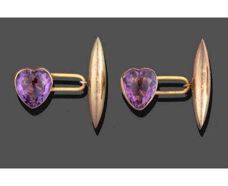 A Pair of 9 Carat Gold Amethyst Cufflinks, the heart shaped amethyst in a yellow rubbed over setting chain linked to a torped