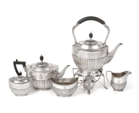 A Four-Piece Edward VII Silver Tea-Service with a Victorian Silver Tea-Caddy En-Suite, by William Hutton and Sons, London and