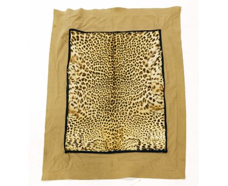 A Leopard Skin Travel Rug, circa 1935, the skin panel 97cm x 68cm mounted on canvas backing panel 140cm x 100cm, with trunk l