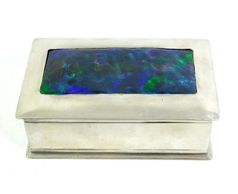Liberty and Co., a Tudric pewter and enamel casket, 0125, the lid with purple green enamelled plaque, cedar lined, 16.6cm wid
