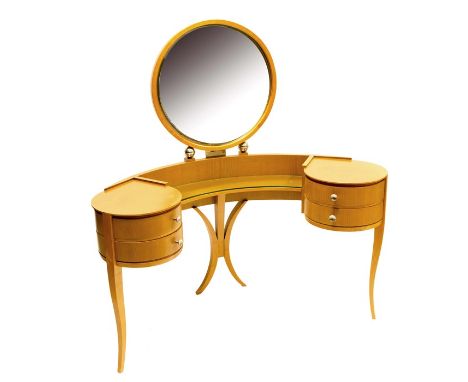 An Art Deco Dressing Table, French circa 1930, in maple, the four drawer construction raised on central support flanked by tw