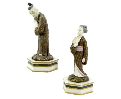 A pair of Royal Worcester Aesthetic Movement figures, 1873, modelled as a Japanese man and woman with fans, on hexagonal base