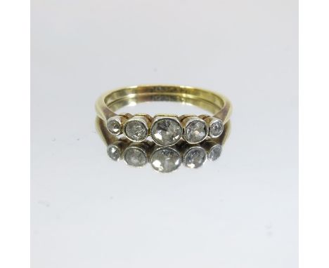 A five stone diamond and 18 carat gold ring, the graduated old cut stones set in platinum, approx size K