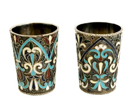 A pair of Imperial Russian silver and cloisonné enamelled beakers, Moscow circa 1910, each with foliate scroll decoration in 