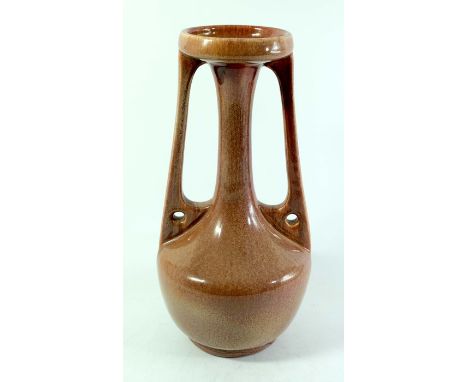 A Bretby Art Pottery twin handled vase, circa 1910, in the Secessionist style, narrow necked baluster form with winged buttre