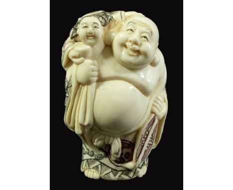 λ A 19th century Japanese ivory netsuke, Meiji, modelled as a fat man with child, polychrome decorated, 5cm long