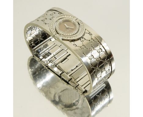 A Gucci ladies model 112, diamond encrusted bangle wrist watch, swivel dial set with diamonds, reticulated bracelet, in origi