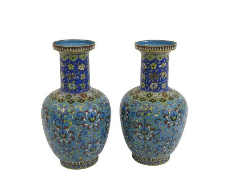 A pair of Chinese cloisonne vases, shouldered form, blue ground with foliate scroll decoration below ruyi head borders, 21cm 