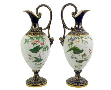 A pair of Royal Worcester ewers, 1901, pedestal form, painted with green parrot decoration, between gilt and blue borders, gr