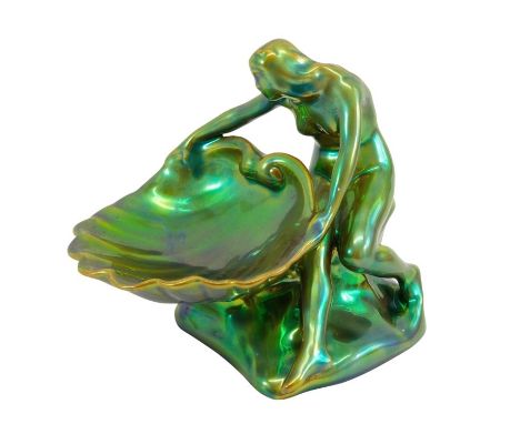 A Zsolnay lustre figure, circa 1960, modelled as a nude woman holding a shell, printed mark, 14cm high