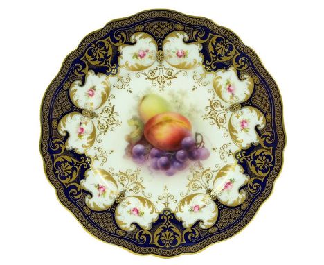 Richard Sebright for Royal Worcester, a fruit painted cabinet plate, 1909, plums and grapes, within a gilt and blue foliate s