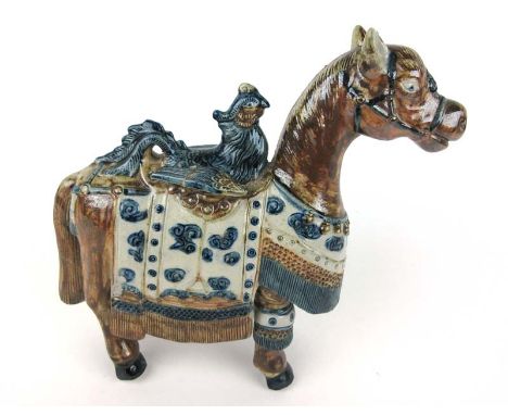 A Chinese style ceramic figure of a horse and bird, decorated in blue and brown colours. H 26.5 cm CONDITION REPORT: Wing of 