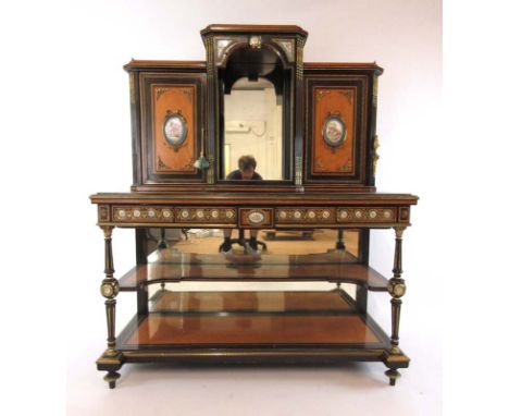 A 19th century French ebony, satinwood and brass mounted Bonheur du jour, the galleried breakfront top having two cupboard do