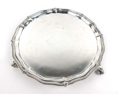 A large Edwardian silver platter on ball and claw feet. Hallmarked for London 1908. Approx weight 948g CONDITION REPORT: Mark