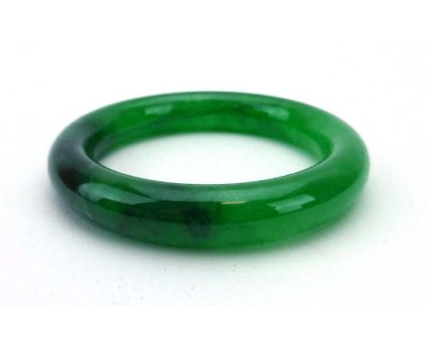 A green jade bangle, internal d. 5.6 cm