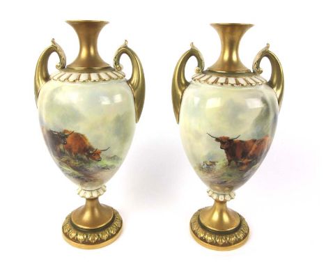 A pair of Royal Worcester twin handled vases with hand painted scenes of highland cattle by James Stinton, dated 1917. H. 30 