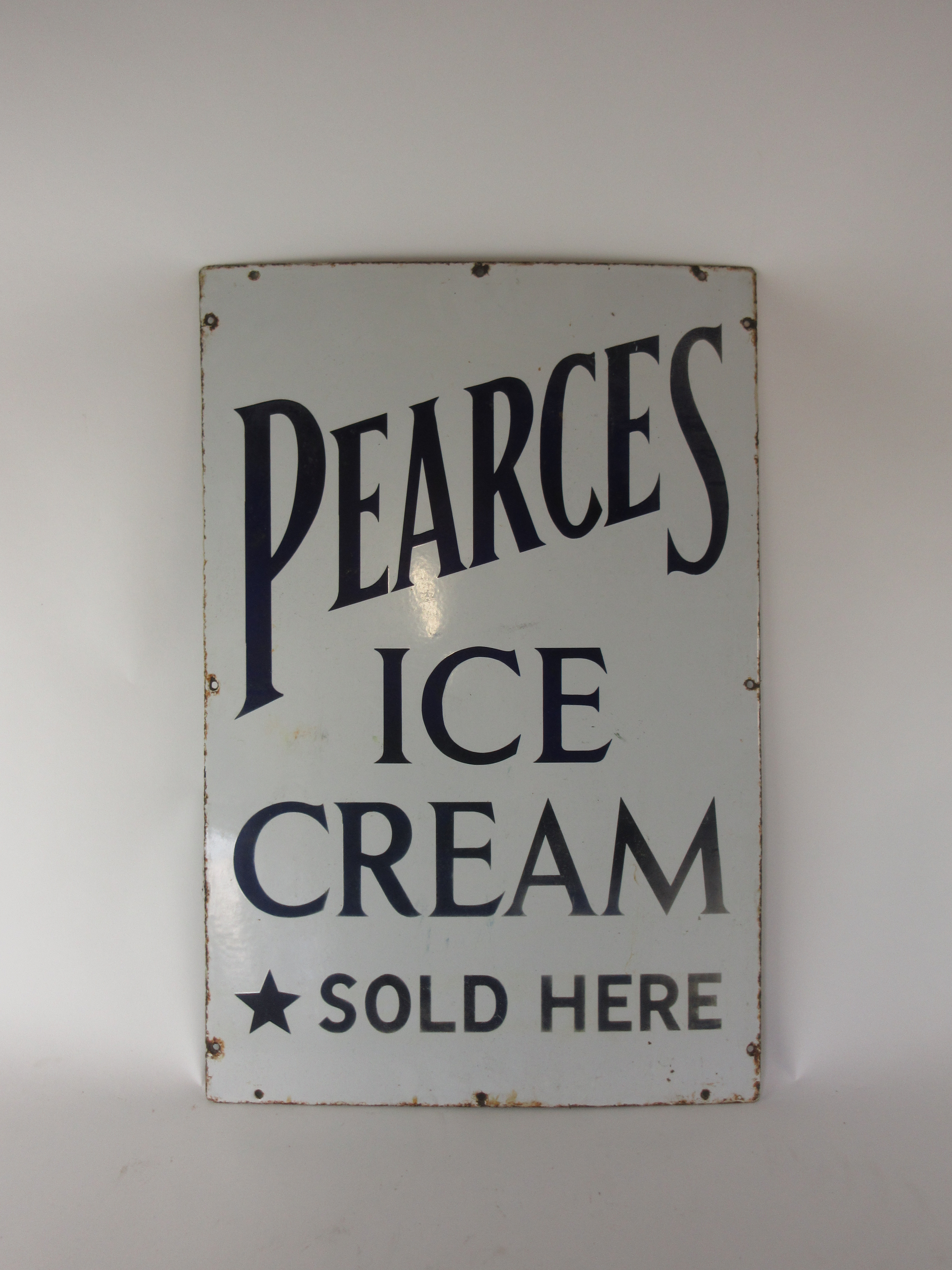 An enamelled advertising sign 'Pearce's Ice Cream sold here', 77 x 51 cm