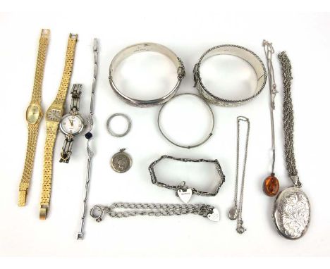 An assortment of silver jewellery to include engraved bangles, gate link bracelet, locket etc together with three ladies watc